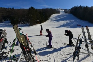 Skiers enjoy the fresh powder and sunny conditions on the slopes of Berkshire East
