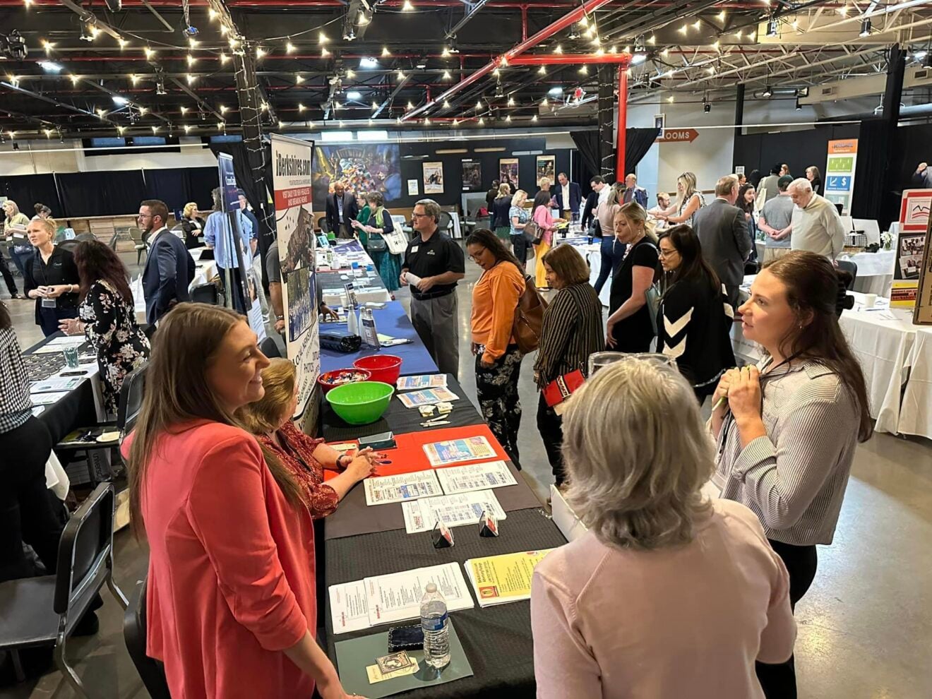 A group of people talk and interact at the Small Business Resource Expo